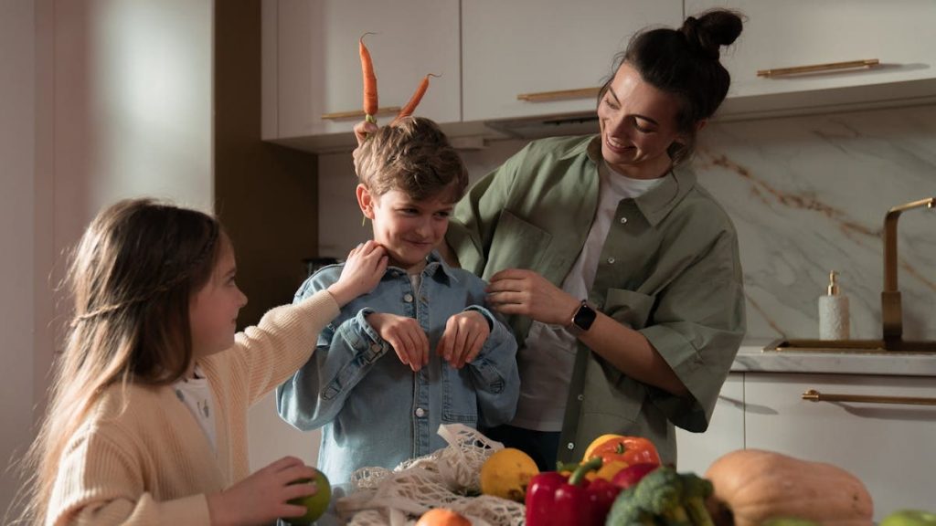 Mother and children have fun unpacking vegetables in the kitchen.